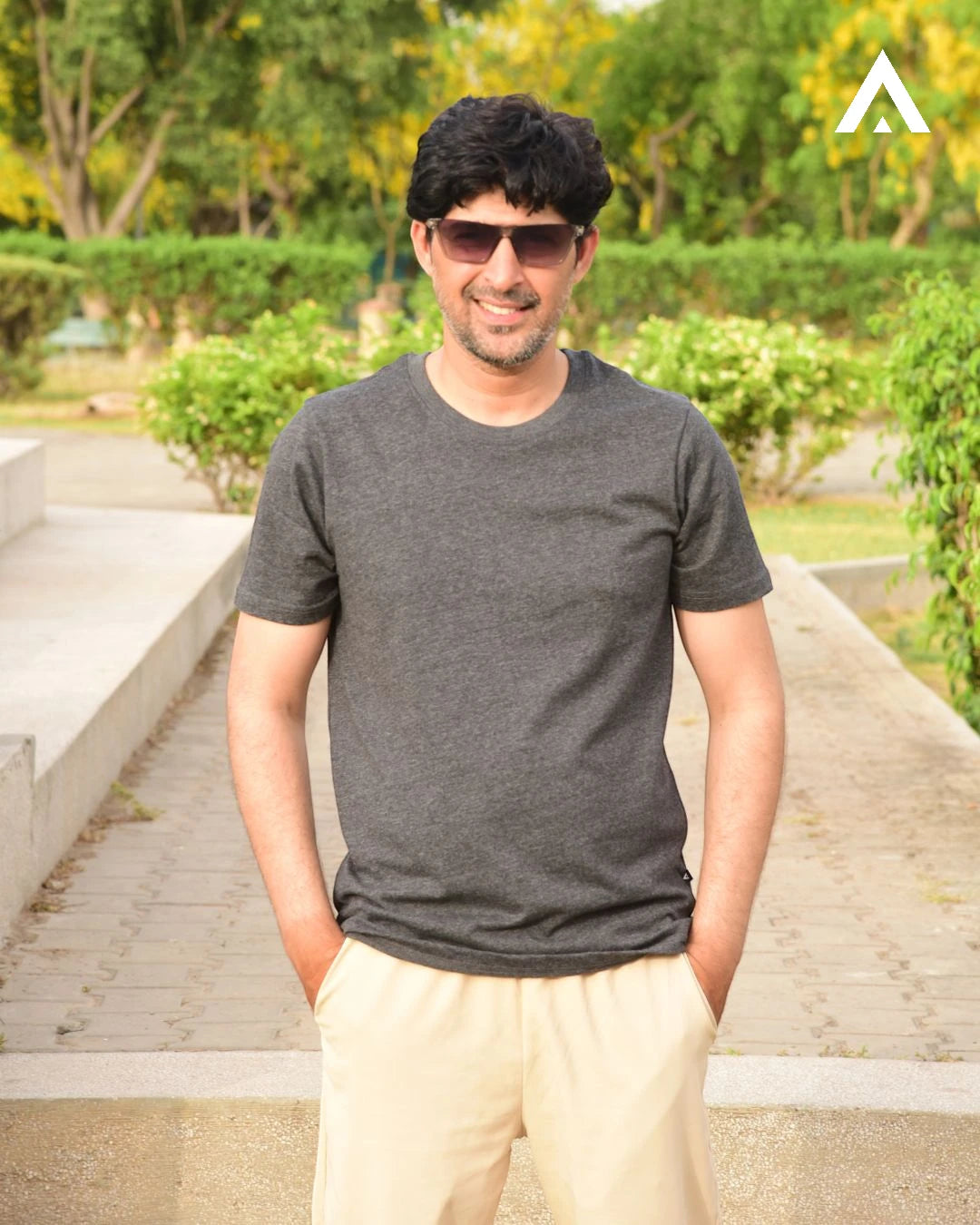 Model in a charcoal t shirt